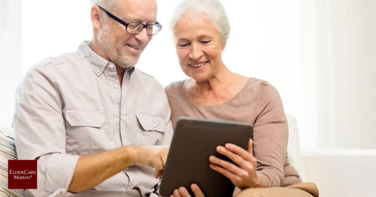 Elderly couple reading expert Elder Care articles on a laptop.